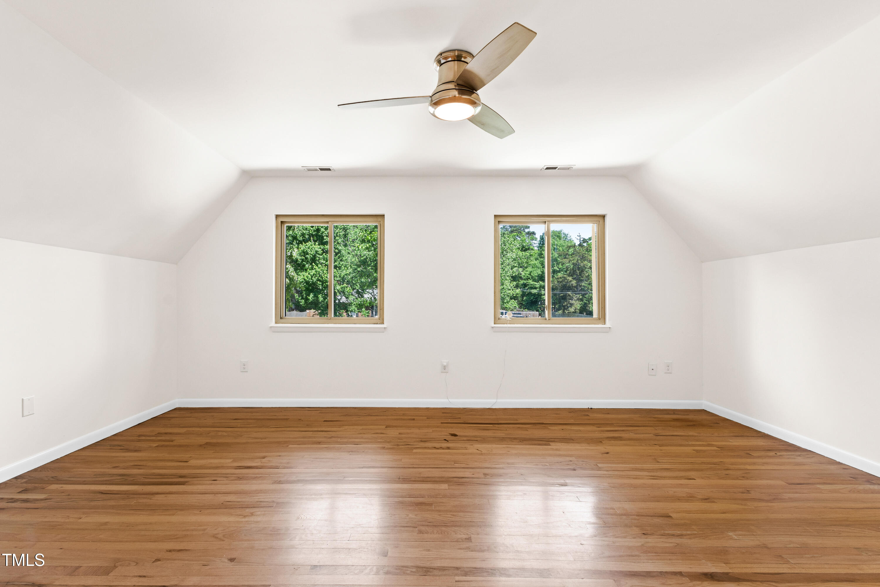 1915 Redding Lane Durham, NC 27712 - Photo 37 of 45 an empty room with wooden floor ceiling fan and window