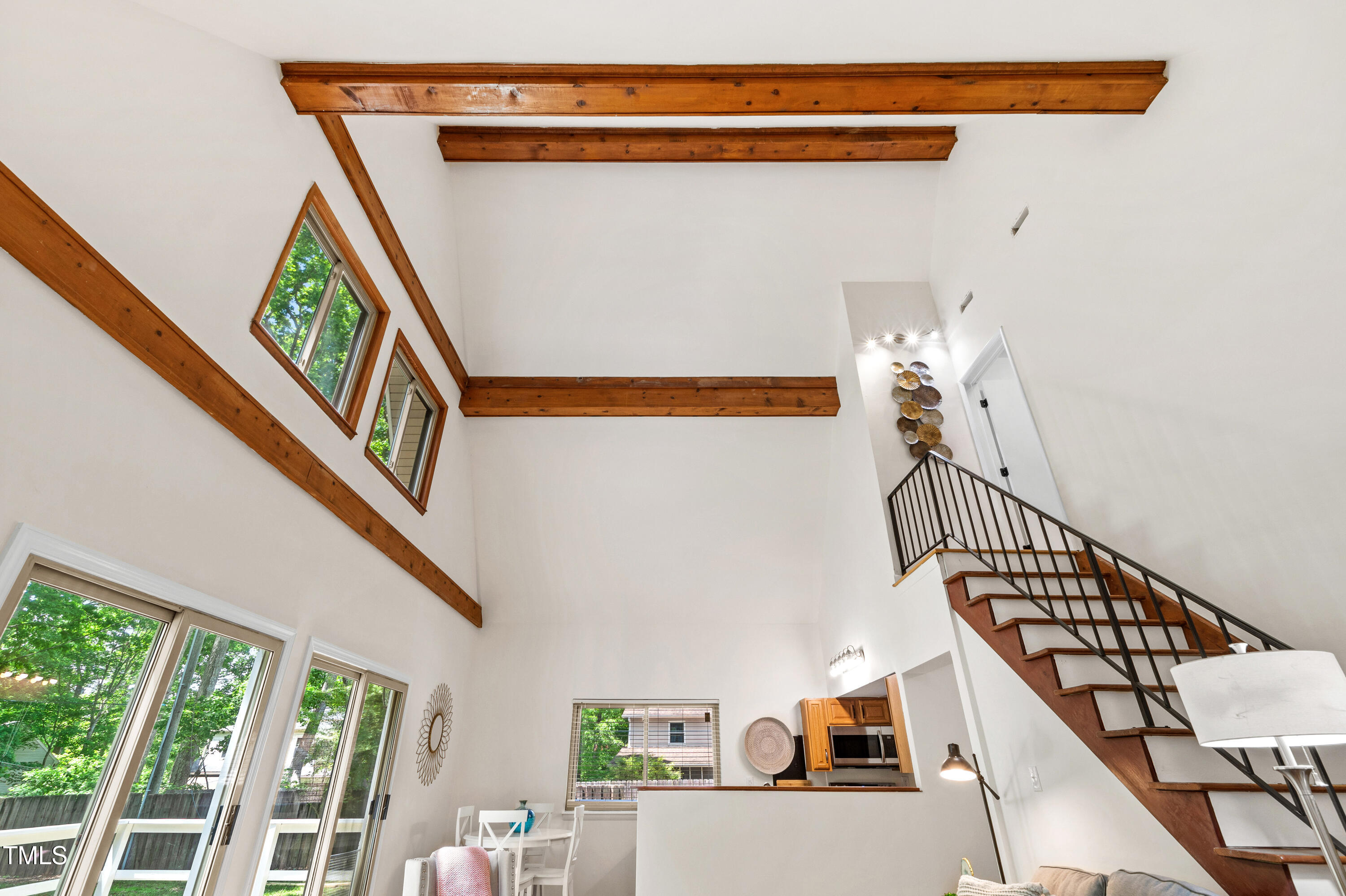 1915 Redding Lane Durham, NC 27712 - Photo 6 of 45 a view of a hallway with wooden floor and stairs
