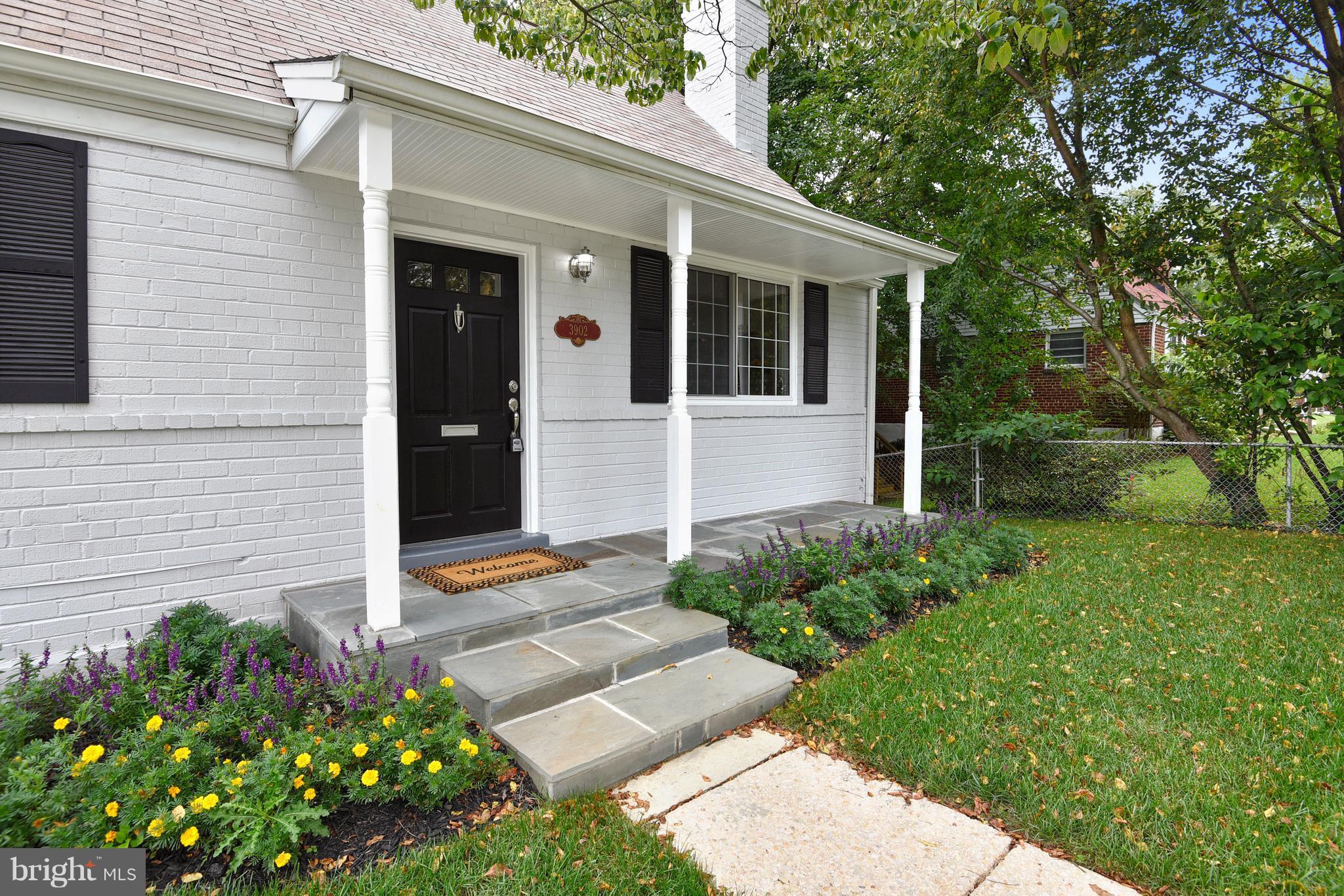 3902 Randolph Road Wheaton, MD 20902 - Photo 2 of 30 a front view of a house with garden