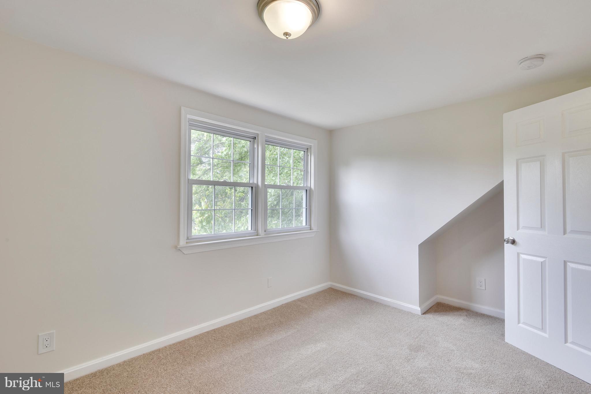 3902 Randolph Road Wheaton, MD 20902 - Photo 19 of 30 an empty room with windows and closet