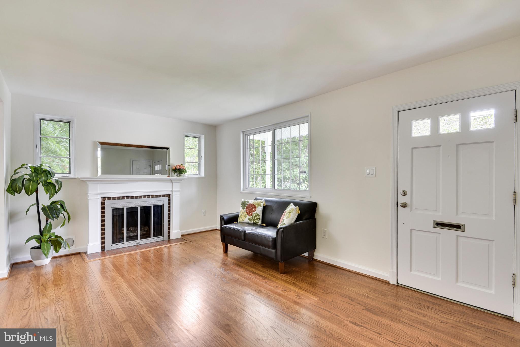 3902 Randolph Road Wheaton, MD 20902 - Photo 3 of 30 a living room with furniture and a fireplace