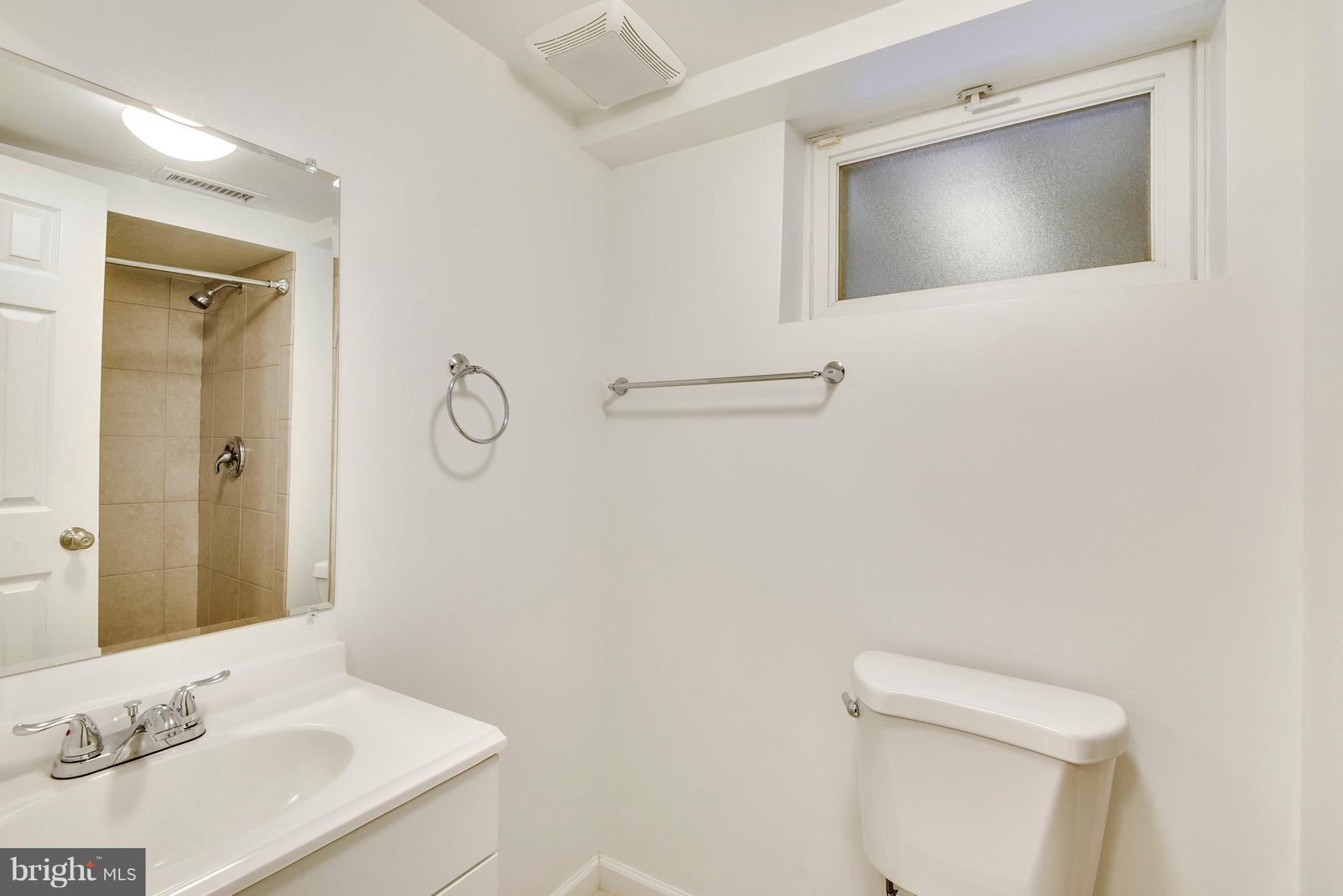 3902 Randolph Road Wheaton, MD 20902 - Photo 22 of 30 a bathroom with a sink and a mirror