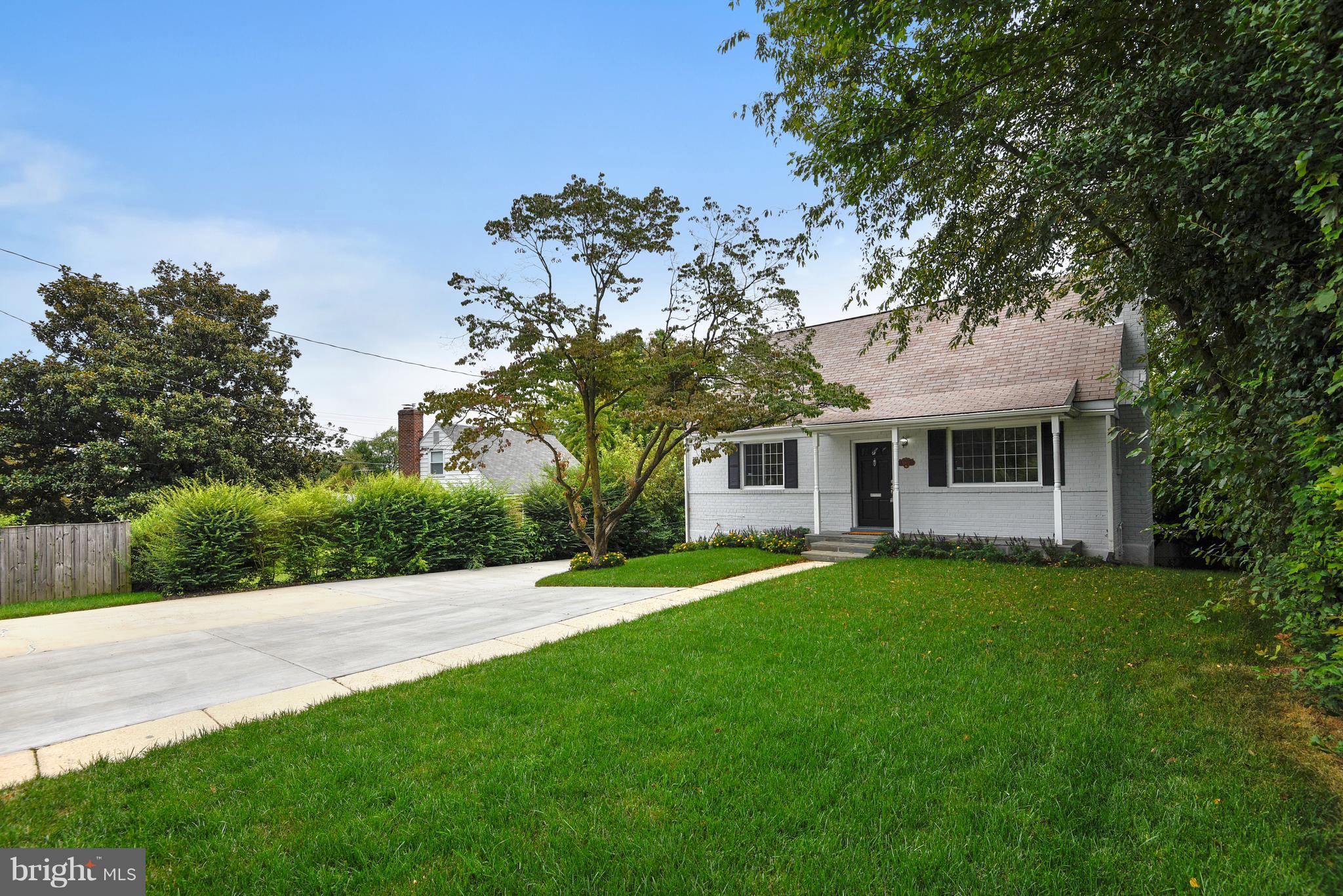 3902 Randolph Road Wheaton, MD 20902 - Photo 24 of 30 a front view of a house with a garden