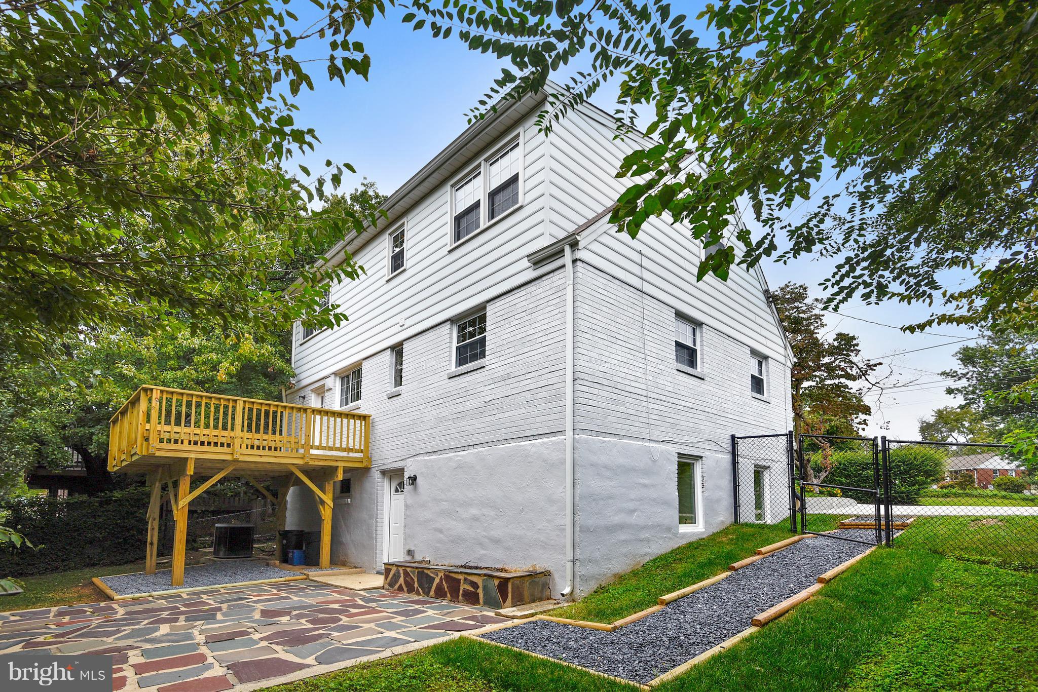 3902 Randolph Road Wheaton, MD 20902 - Photo 26 of 30 a front view of a house with garden