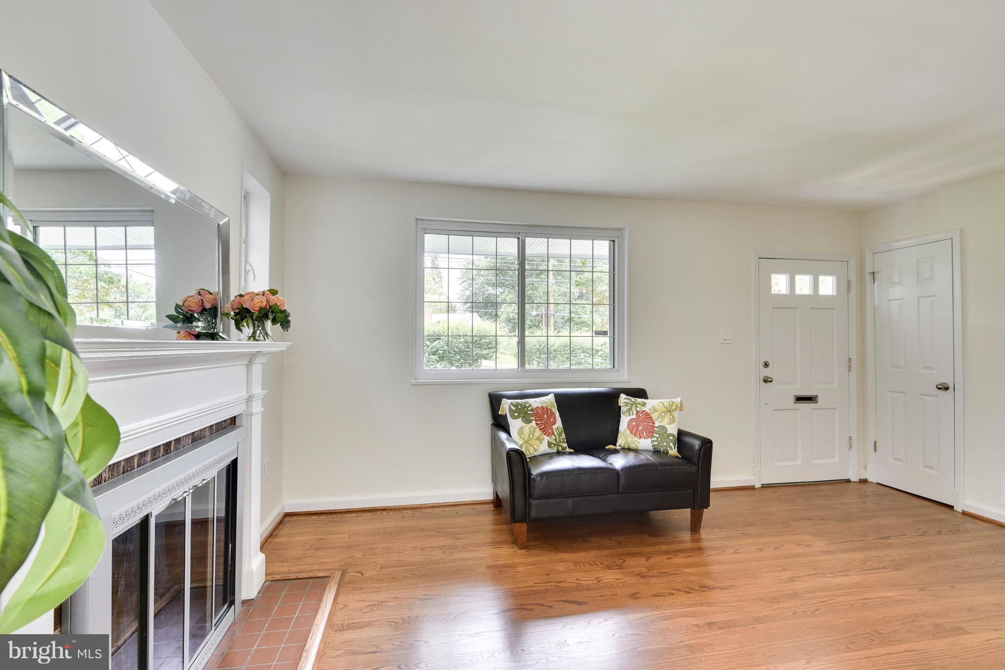3902 Randolph Road Wheaton, MD 20902 - Photo 5 of 30 a living room with furniture and a fireplace
