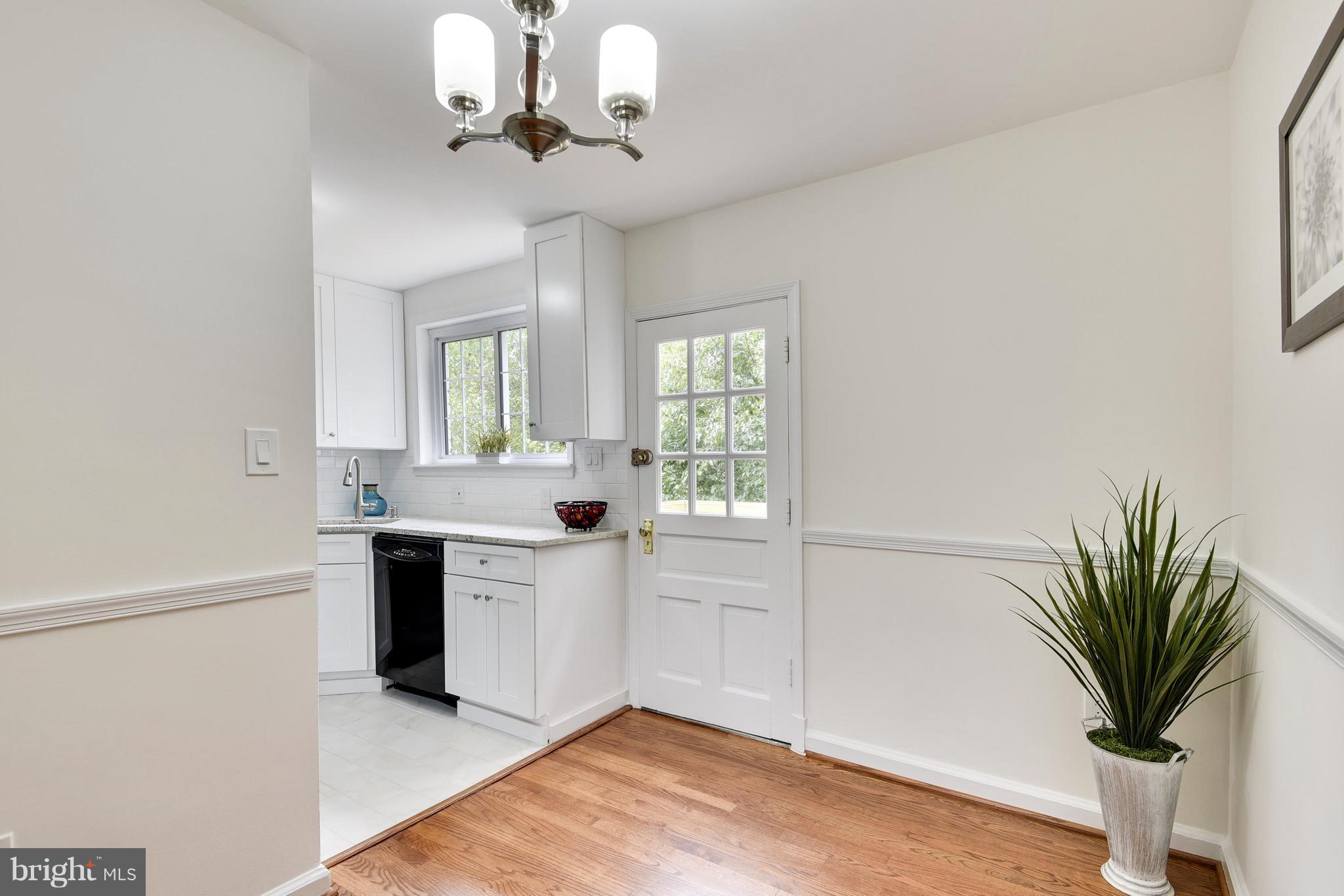 3902 Randolph Road Wheaton, MD 20902 - Photo 9 of 30 a view of a kitchen with a sink and a chandelier