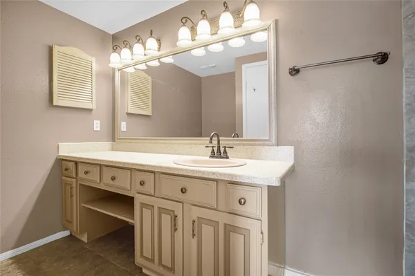 a bathroom with a sink double vanity and a mirror