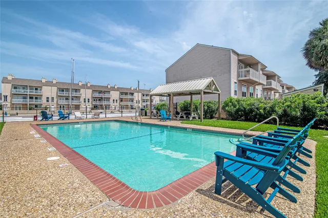 a view of pool with outdoor seating