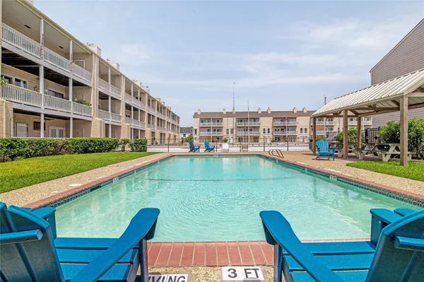 a view of pool with outdoor seating