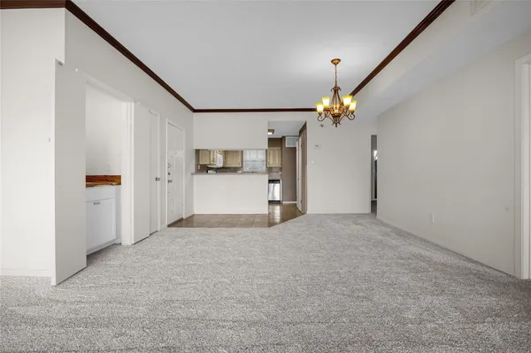 a view of a kitchen with a sink and cabinet area
