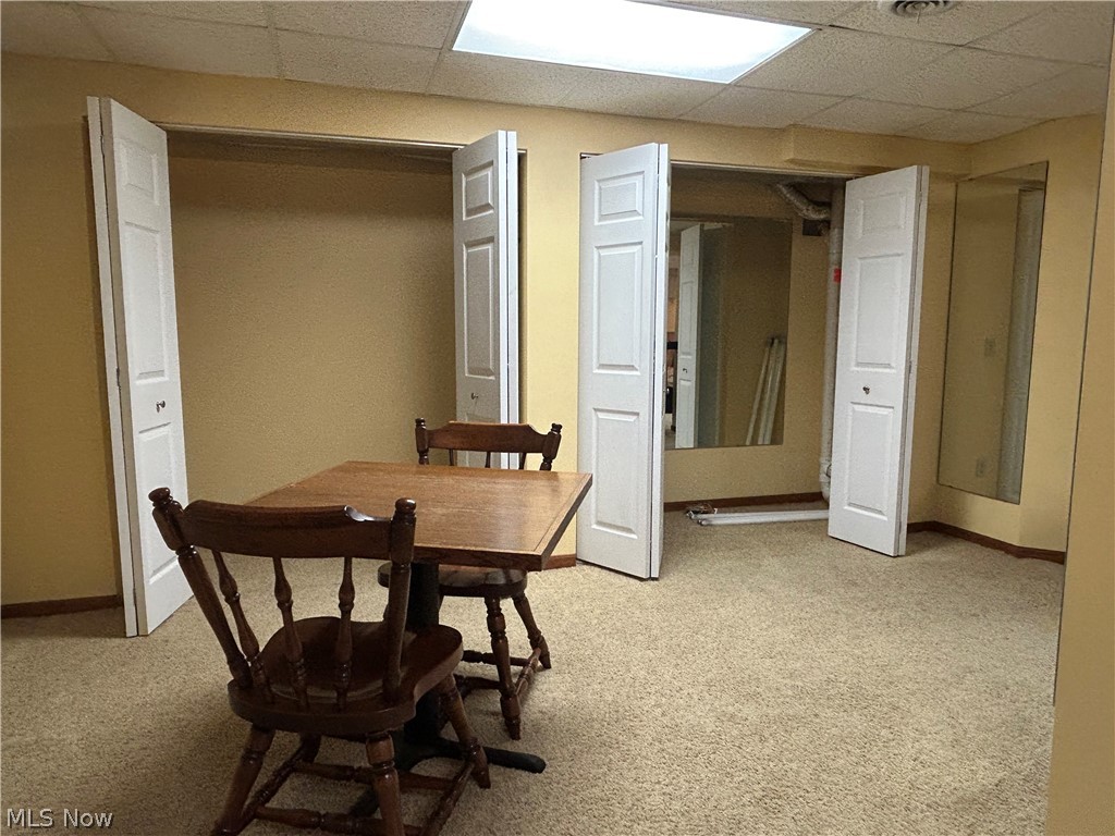 40 East Western Reserve Road, Unit 1 Youngstown, OH 44514 - Photo 18 of 33 Carpeted dining area featuring a drop ceiling