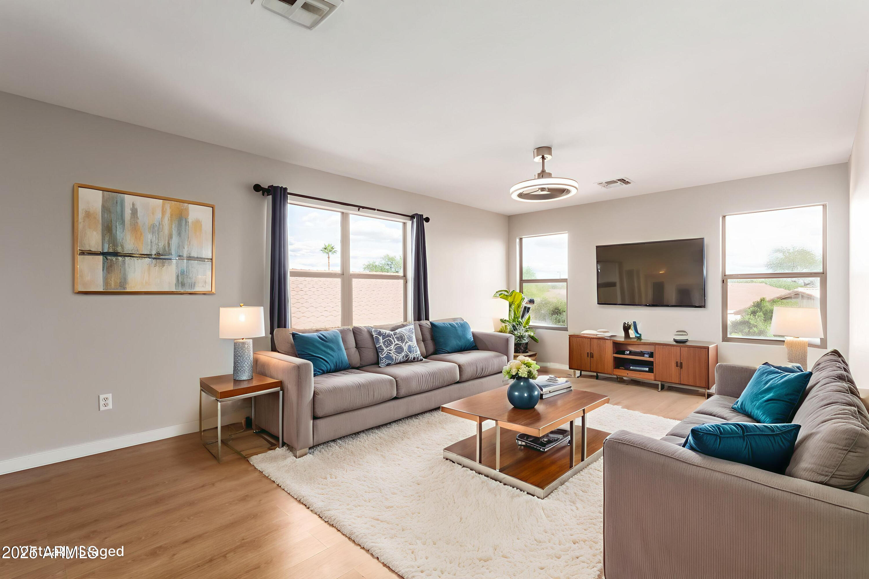 631 South Colonial Court Gilbert, AZ 85296 - Photo 15 of 27 a living room with furniture and a flat screen tv
