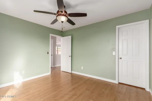 a view of an empty room with a window