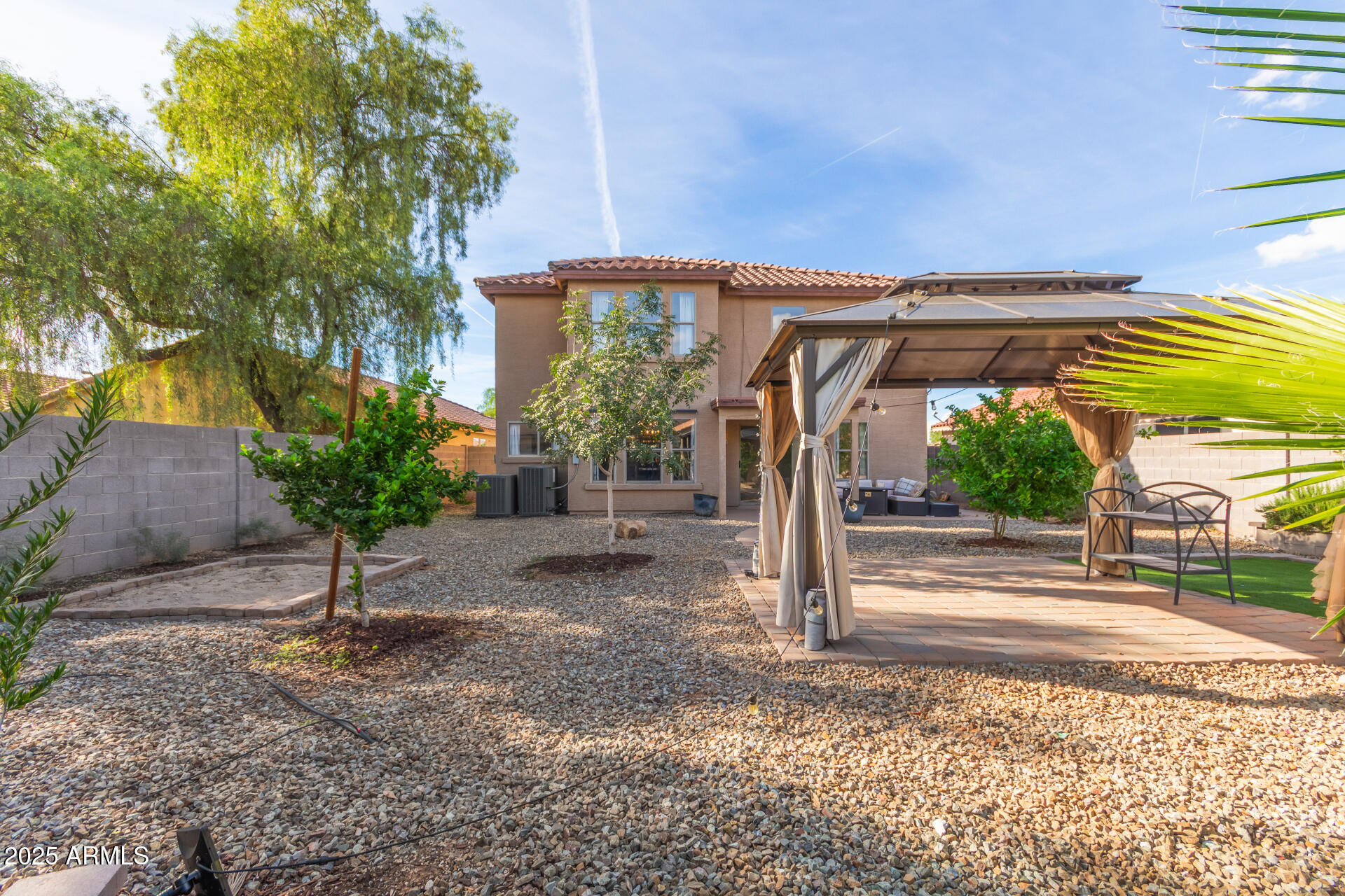 631 South Colonial Court Gilbert, AZ 85296 - Photo 26 of 27 a view of a chair and table in the garden