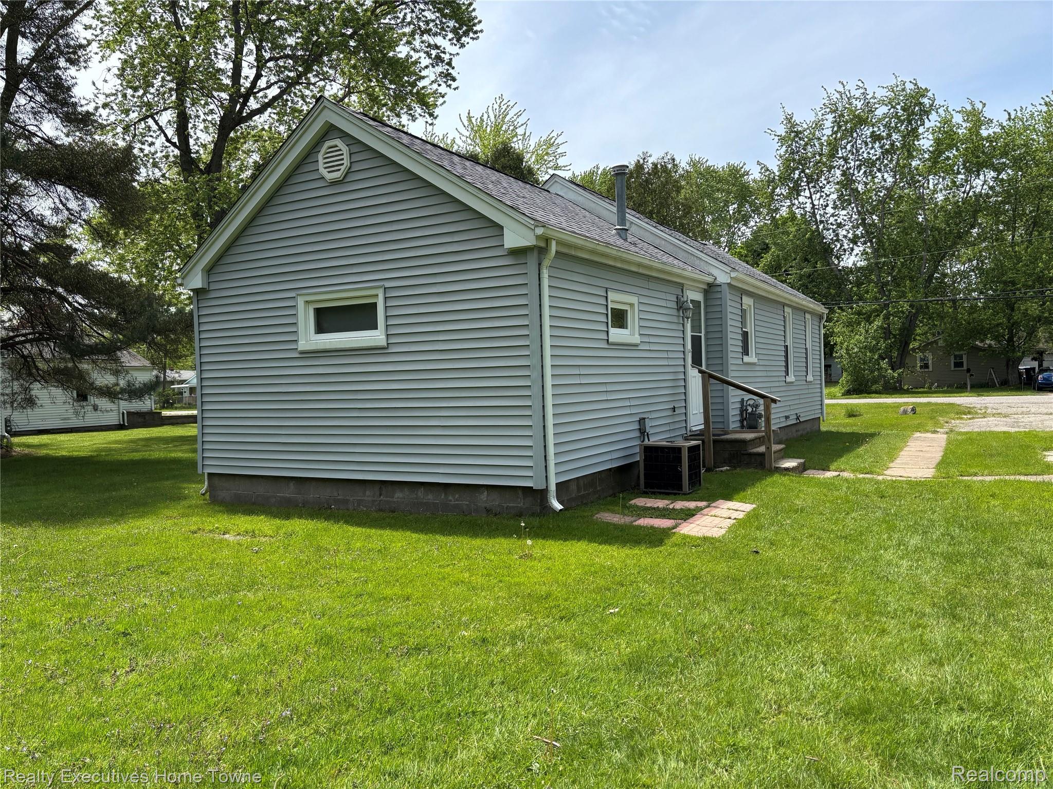 1782 Maple Road Smiths Creek, MI 48074 - Photo 5 of 30 View of back of property featuring a yard