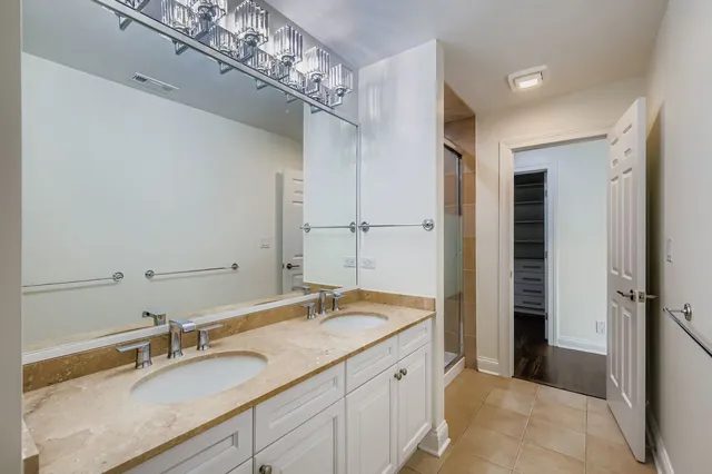a view of a refrigerator in kitchen and a living room