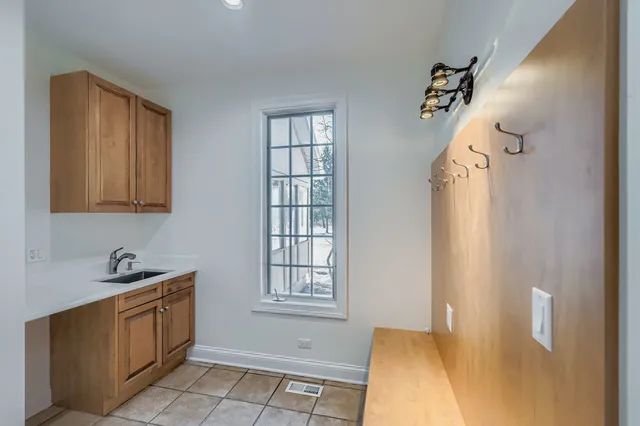a kitchen with a stove a sink and a refrigerator