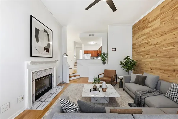 a living room with furniture and a fireplace