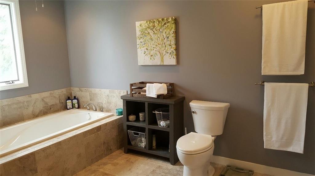 260 Vogel Road Butler, PA 16002 - Photo 13 of 24 The bathroom is finished with beautiful tile flooring to complete its luxurious appeal.