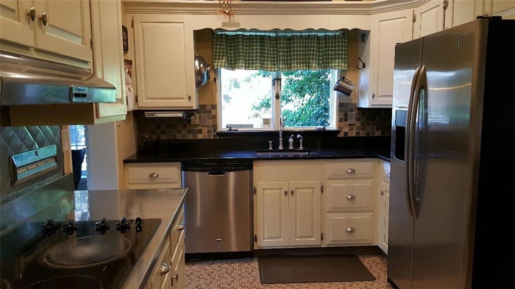 260 Vogel Road Butler, PA 16002 - Photo 6 of 24 The aesthetic appeal is complete with stainless steel and tiled backsplashes on the walls.
