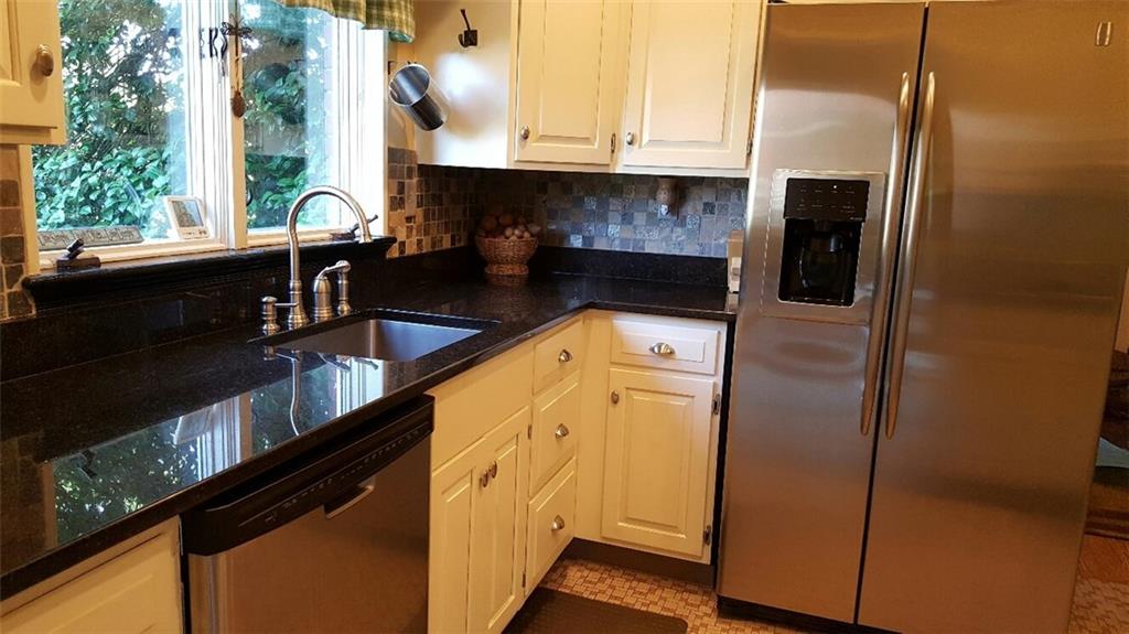 260 Vogel Road Butler, PA 16002 - Photo 7 of 24 White cupboards enhance the kitchen's clean and inviting appearance.