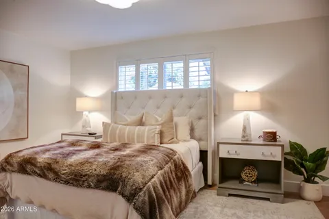 a bedroom with a bed and window