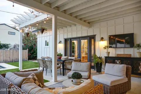 a outdoor space with patio the couches and a dining table with garden view