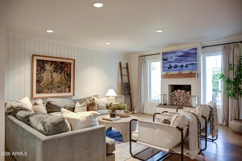 a living room with furniture and a fireplace