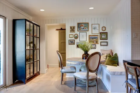 a dining room with furniture and window