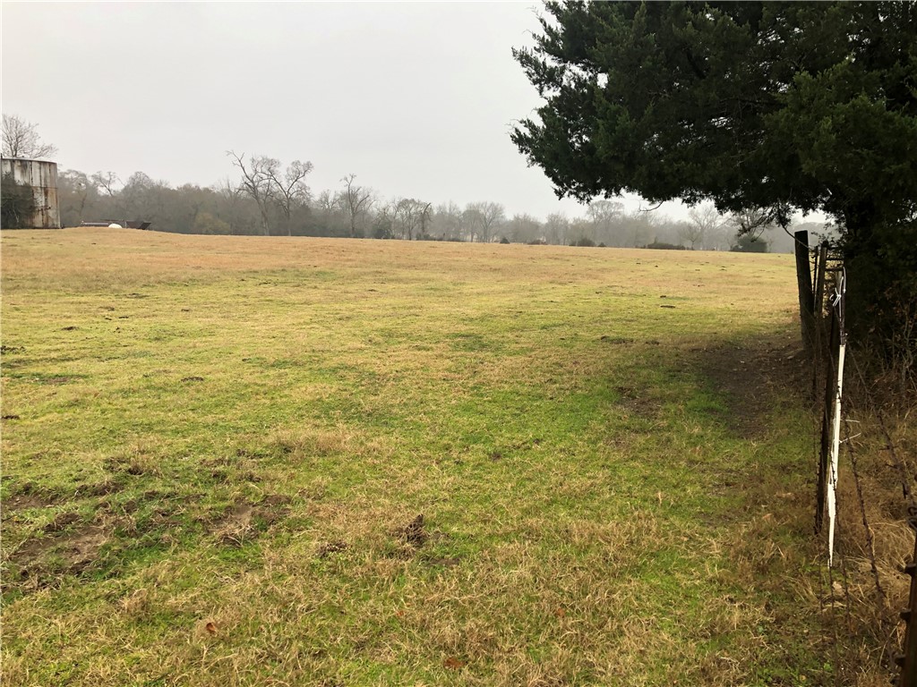 84.09-ac Valley Road Bryan, TX 77807 - Photo 1 of 6 View of yard with a rural view