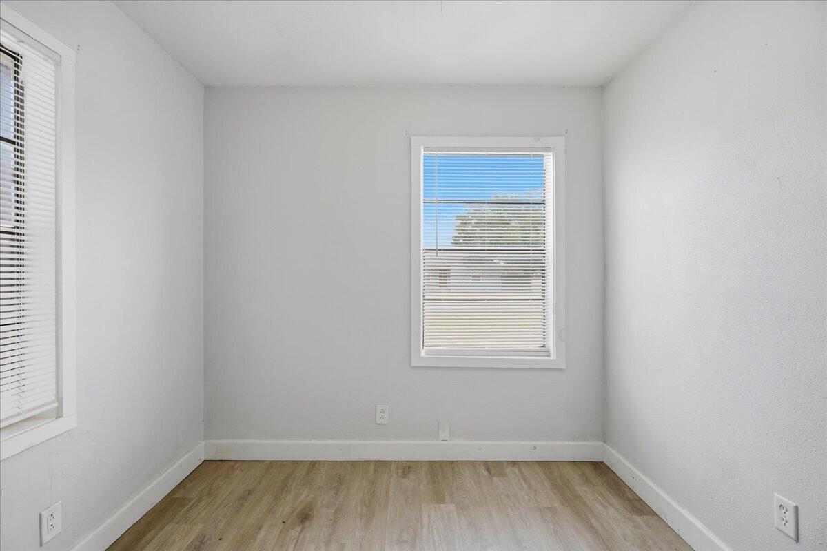2503 30th Street Lubbock, TX 79410 - Photo 10 of 26 an empty room with a window