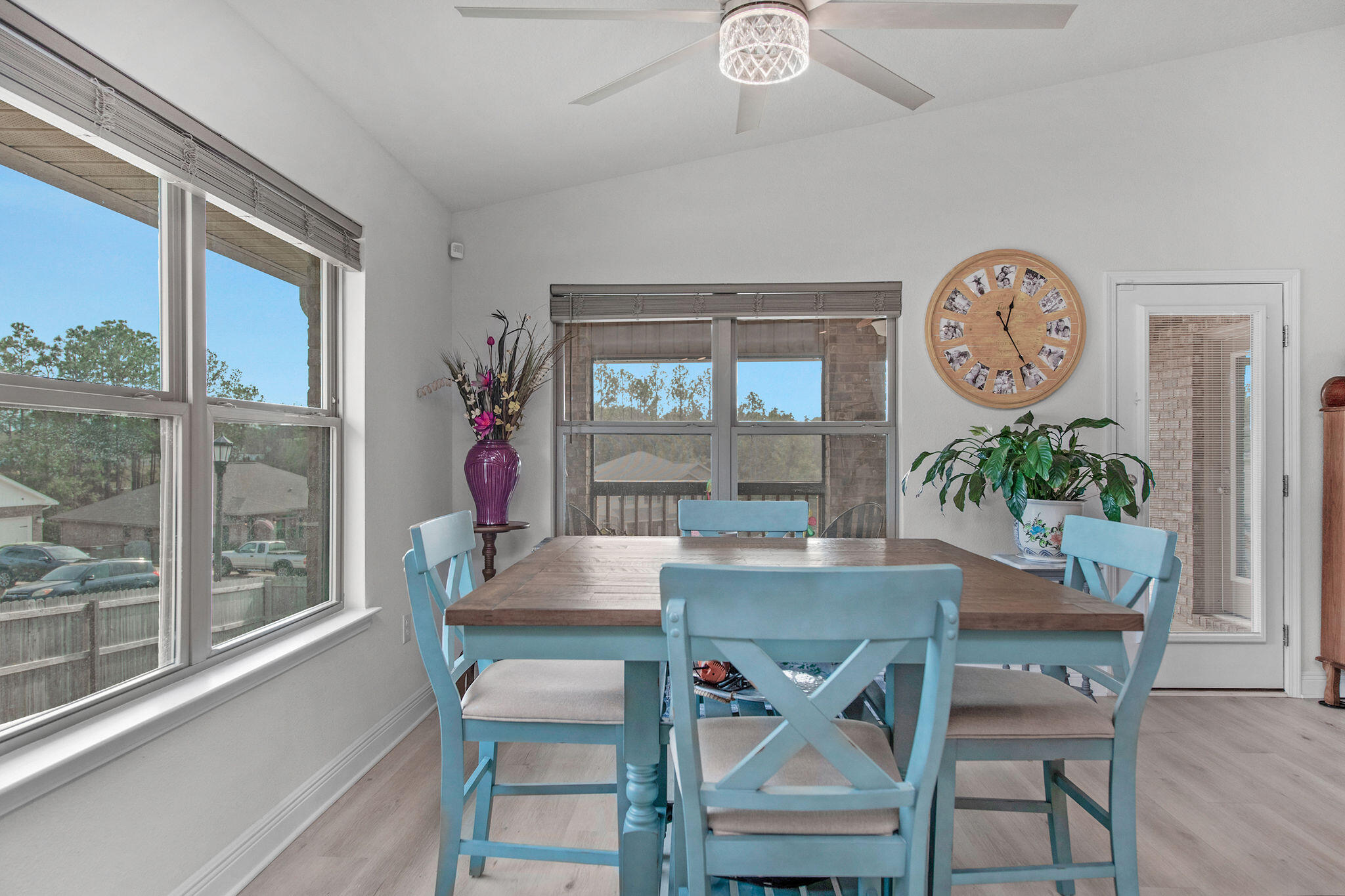 2099 Queen Street Crestview, FL 32536 - Photo 14 of 36 a dining room with furniture a potted plant and a chandelier
