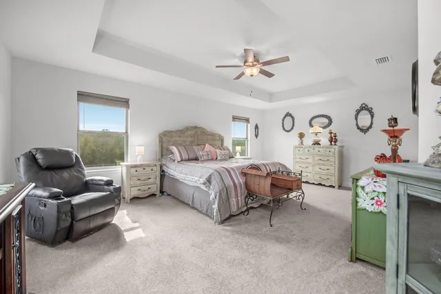 a bedroom with a bed furniture and a window