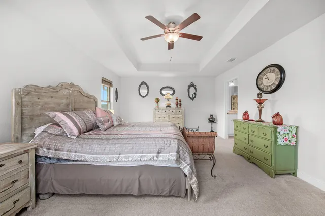 a bedroom with a bed and a chair