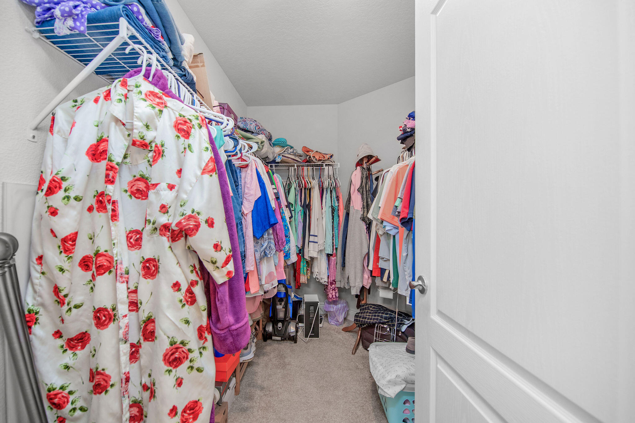 2099 Queen Street Crestview, FL 32536 - Photo 24 of 36 a view of walk in closet with clothes