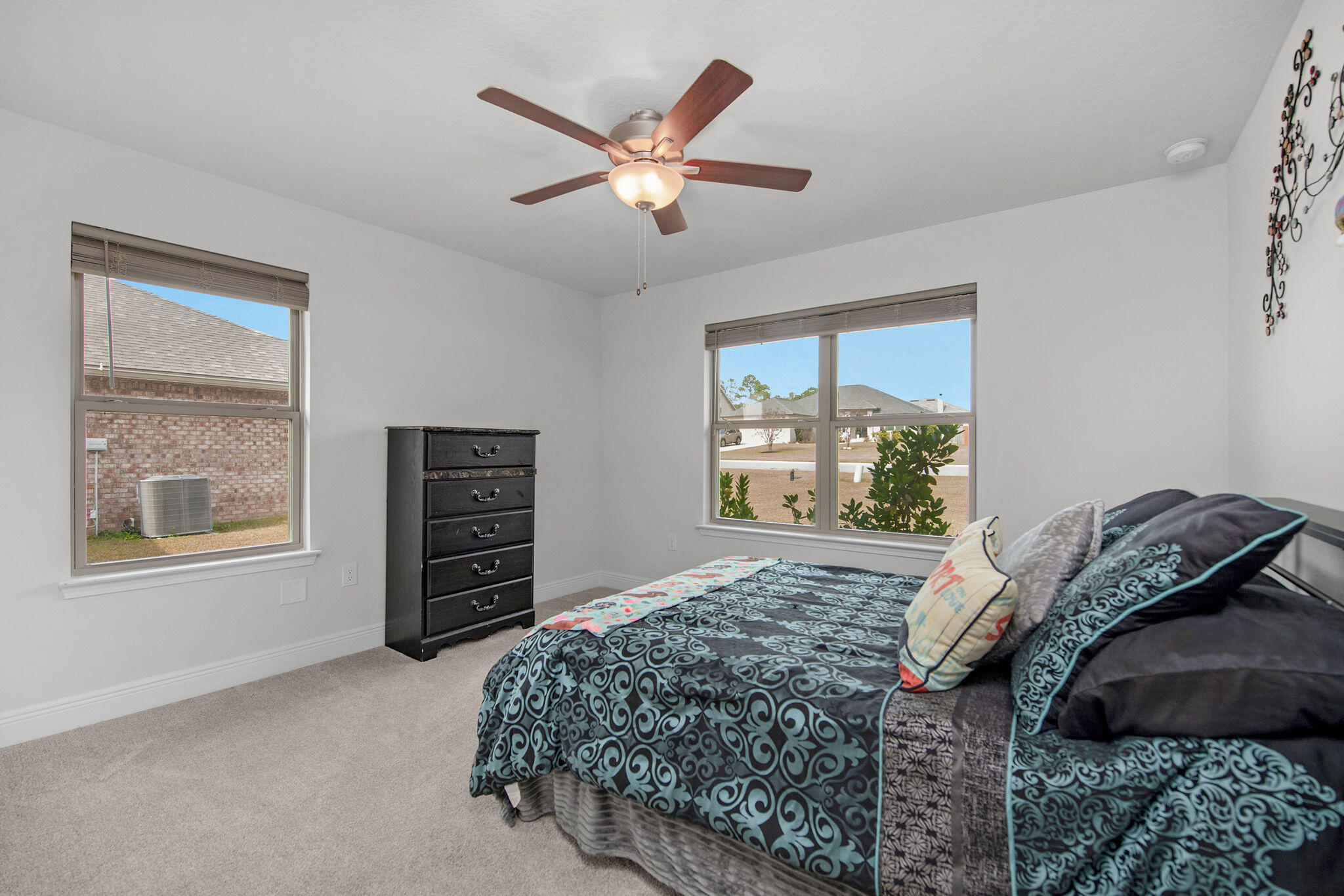 2099 Queen Street Crestview, FL 32536 - Photo 25 of 36 a bedroom with a large bed and a window