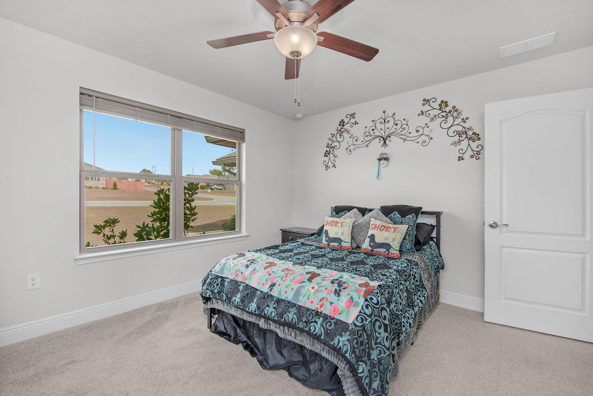 2099 Queen Street Crestview, FL 32536 - Photo 26 of 36 a bedroom with a bed and a window