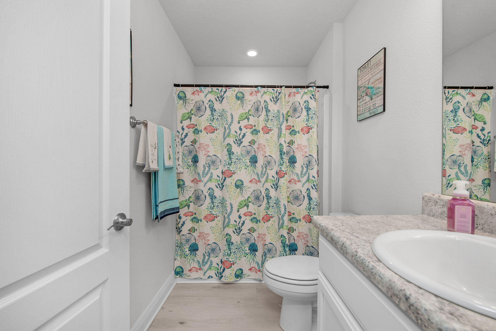 2099 Queen Street Crestview, FL 32536 - Photo 27 of 36 a bathroom with a sink toilet and shower