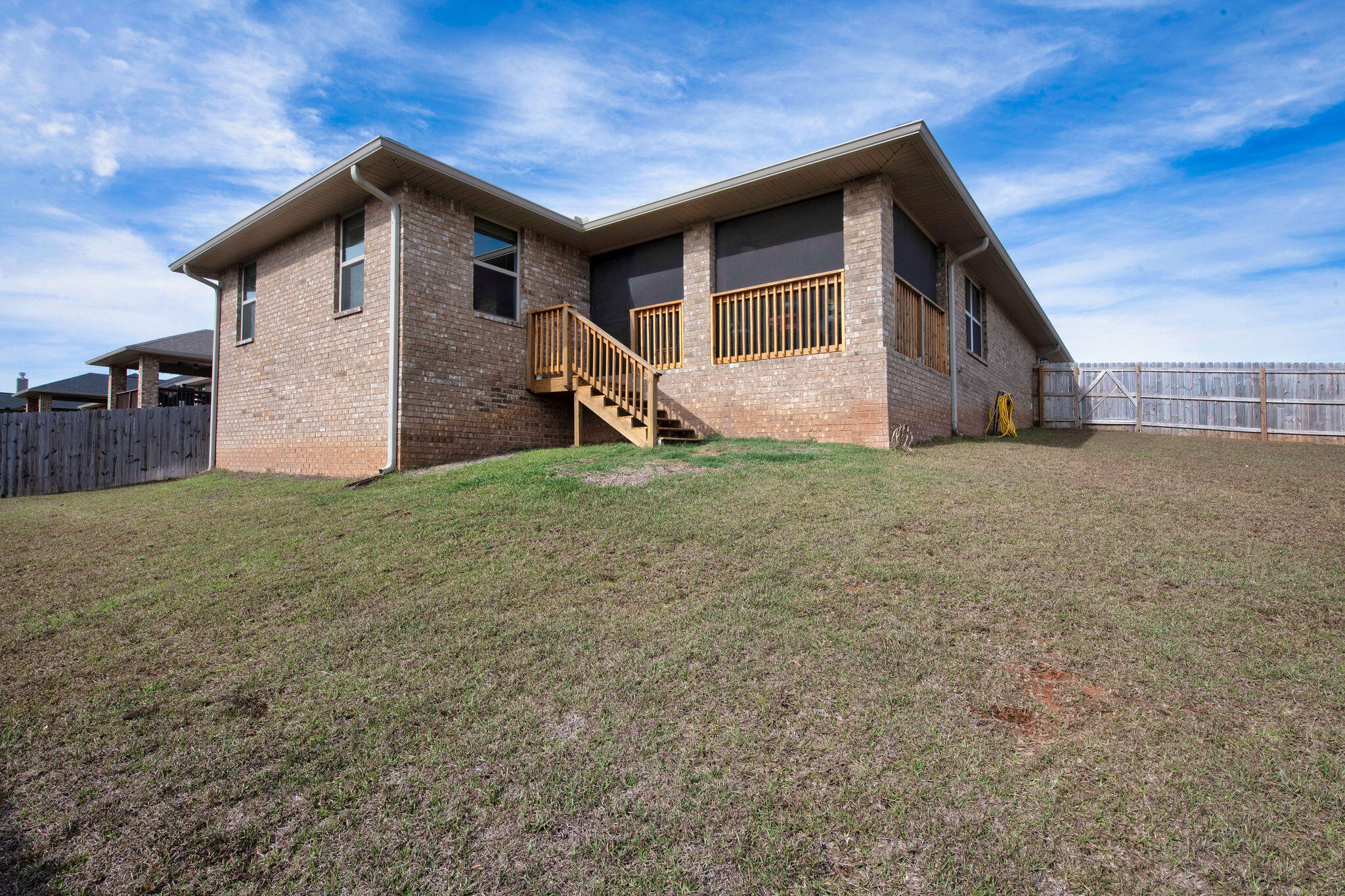 2099 Queen Street Crestview, FL 32536 - Photo 33 of 36 a front view of a house with a yard and garage