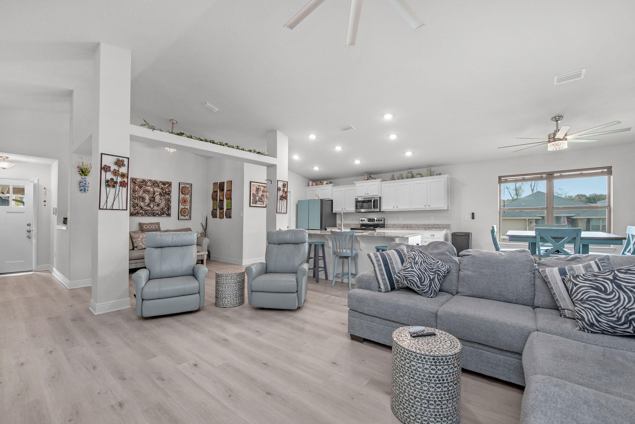 2099 Queen Street Crestview, FL 32536 - Photo 7 of 36 a living room with furniture and a wooden floor