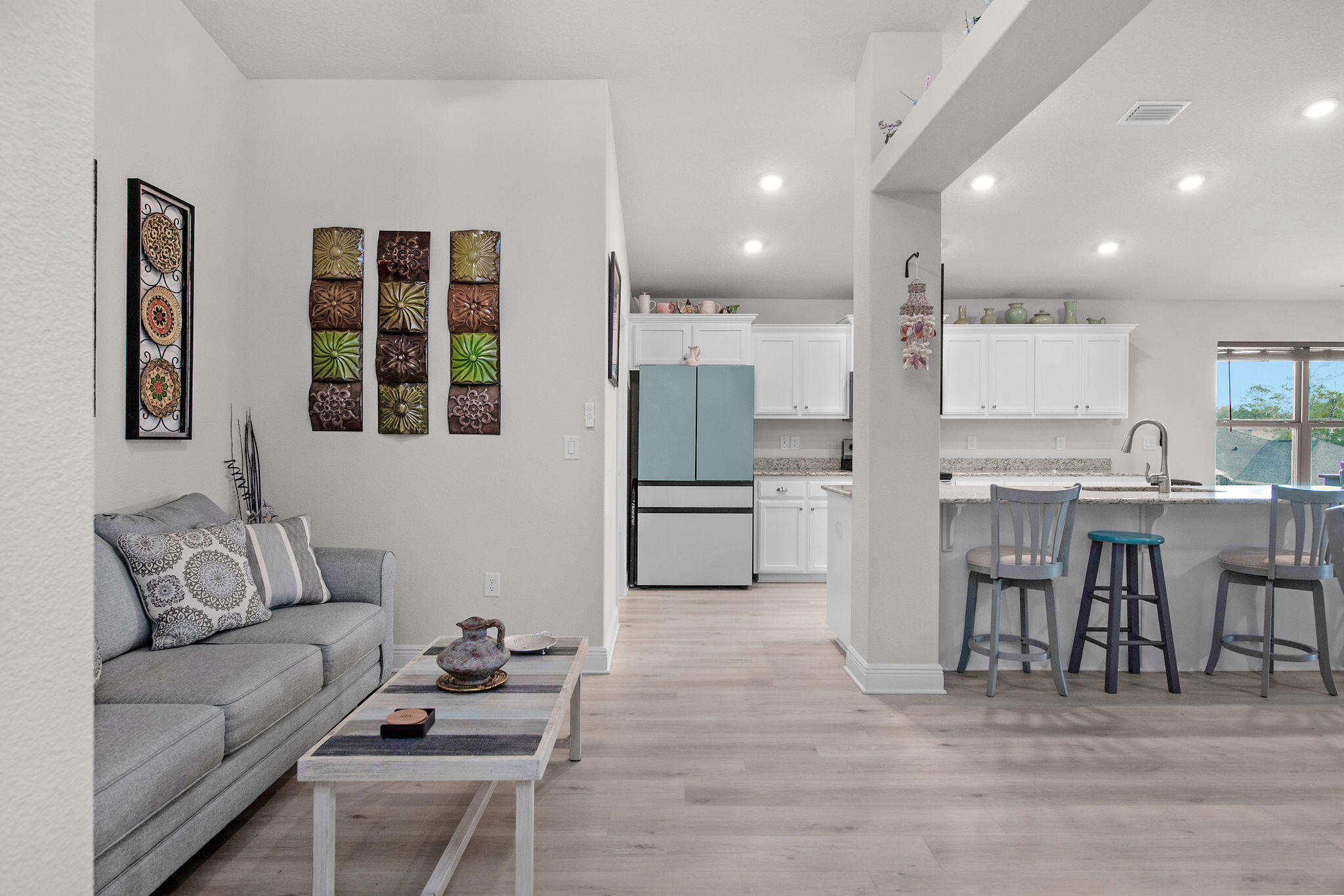 2099 Queen Street Crestview, FL 32536 - Photo 10 of 36 a living room with furniture and kitchen view