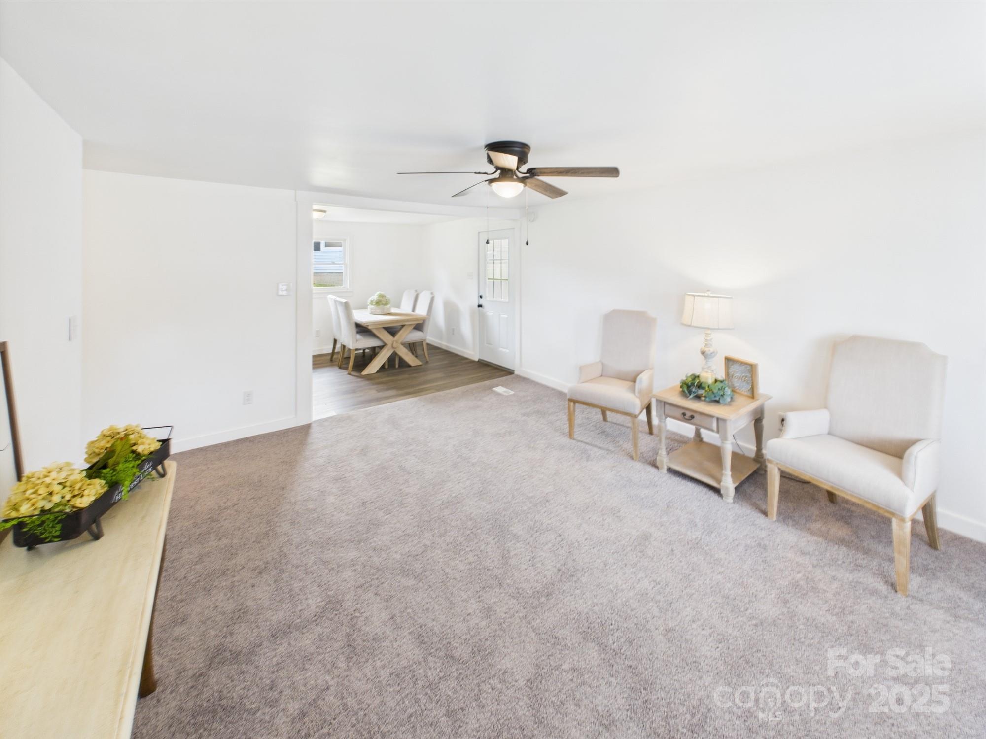 120 Hepler Road Taylorsville, NC 28681 - Photo 11 of 20 a living room with furniture and a chandelier