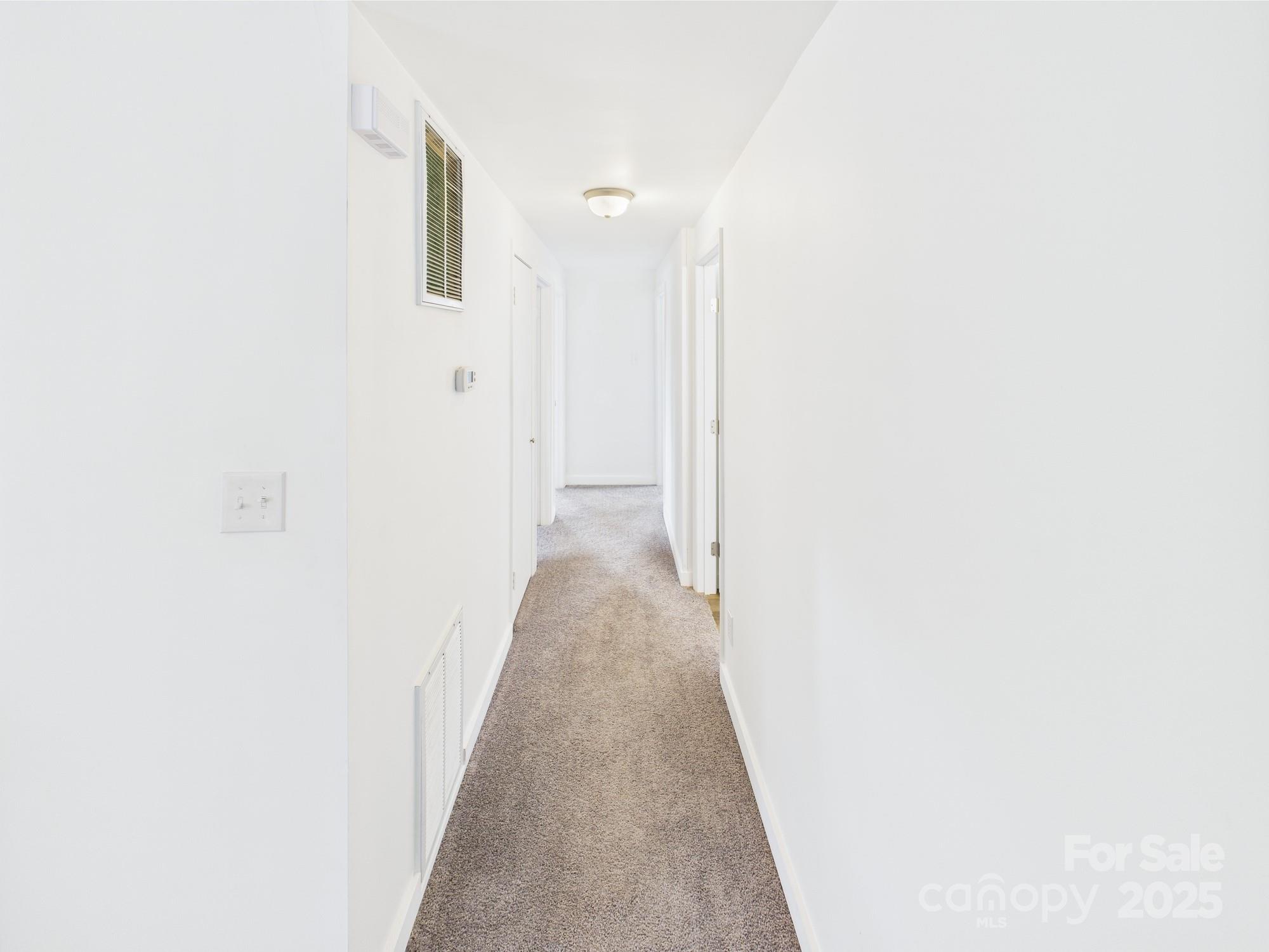120 Hepler Road Taylorsville, NC 28681 - Photo 12 of 20 a view of a hallway with wooden floor