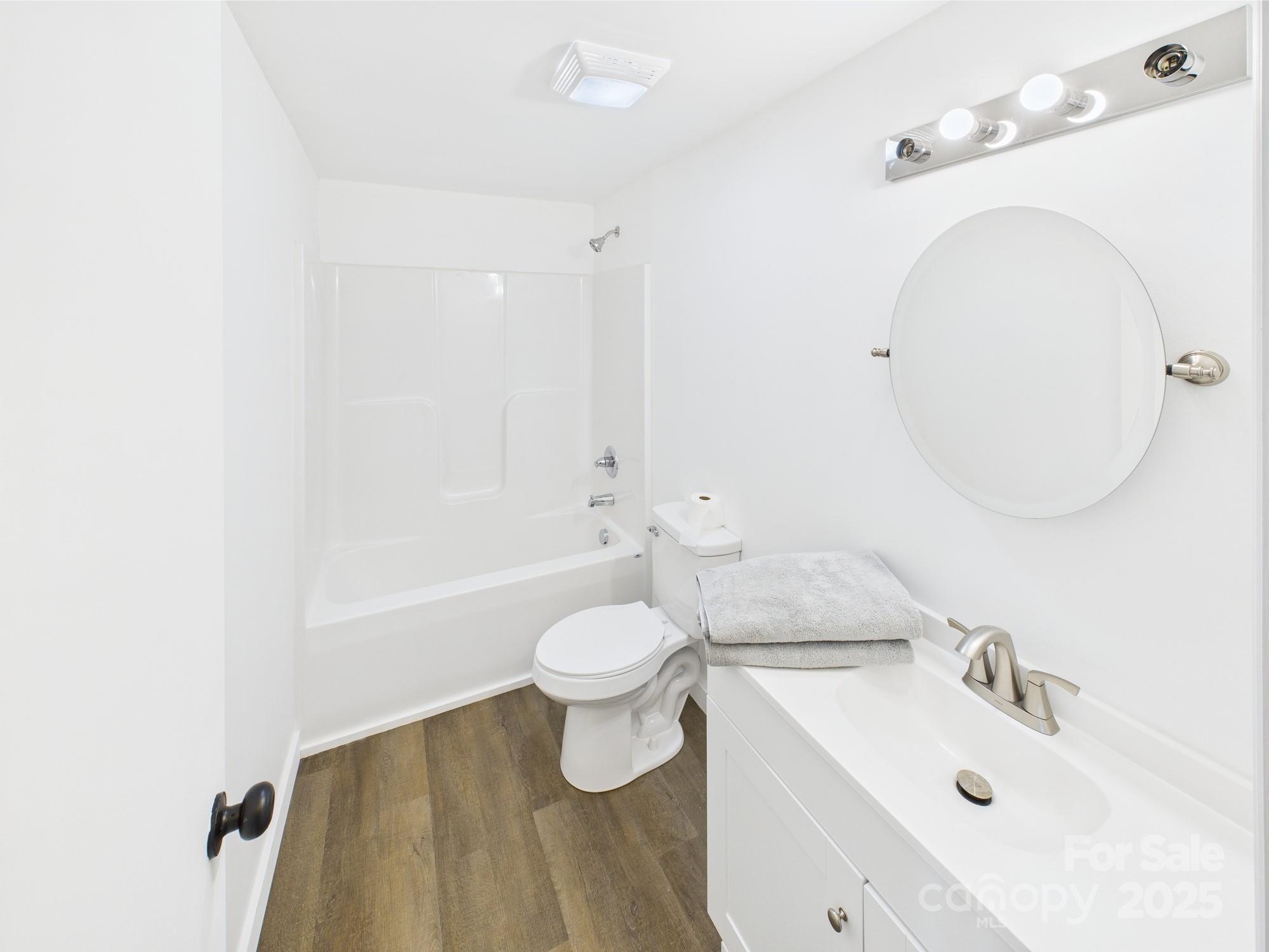 120 Hepler Road Taylorsville, NC 28681 - Photo 13 of 20 a bathroom with a sink a toilet and a mirror