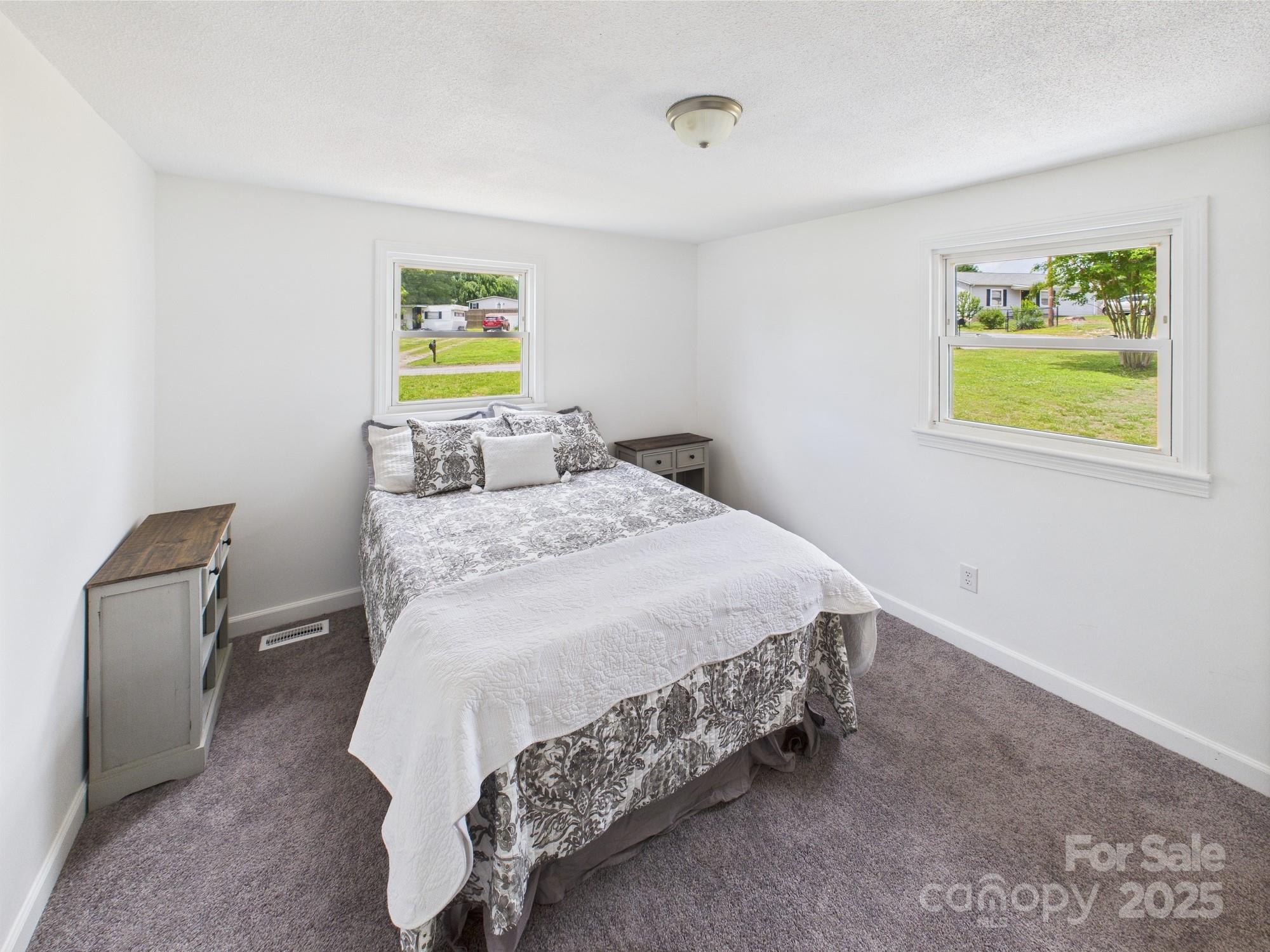 120 Hepler Road Taylorsville, NC 28681 - Photo 16 of 20 a bedroom with a bed and chair