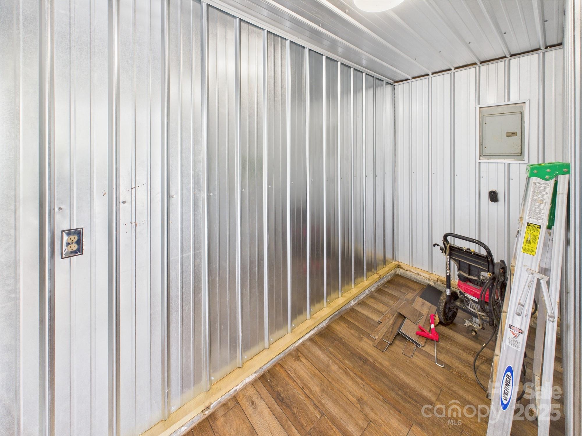 120 Hepler Road Taylorsville, NC 28681 - Photo 18 of 20 a view of a bedroom with wooden floor and furniture