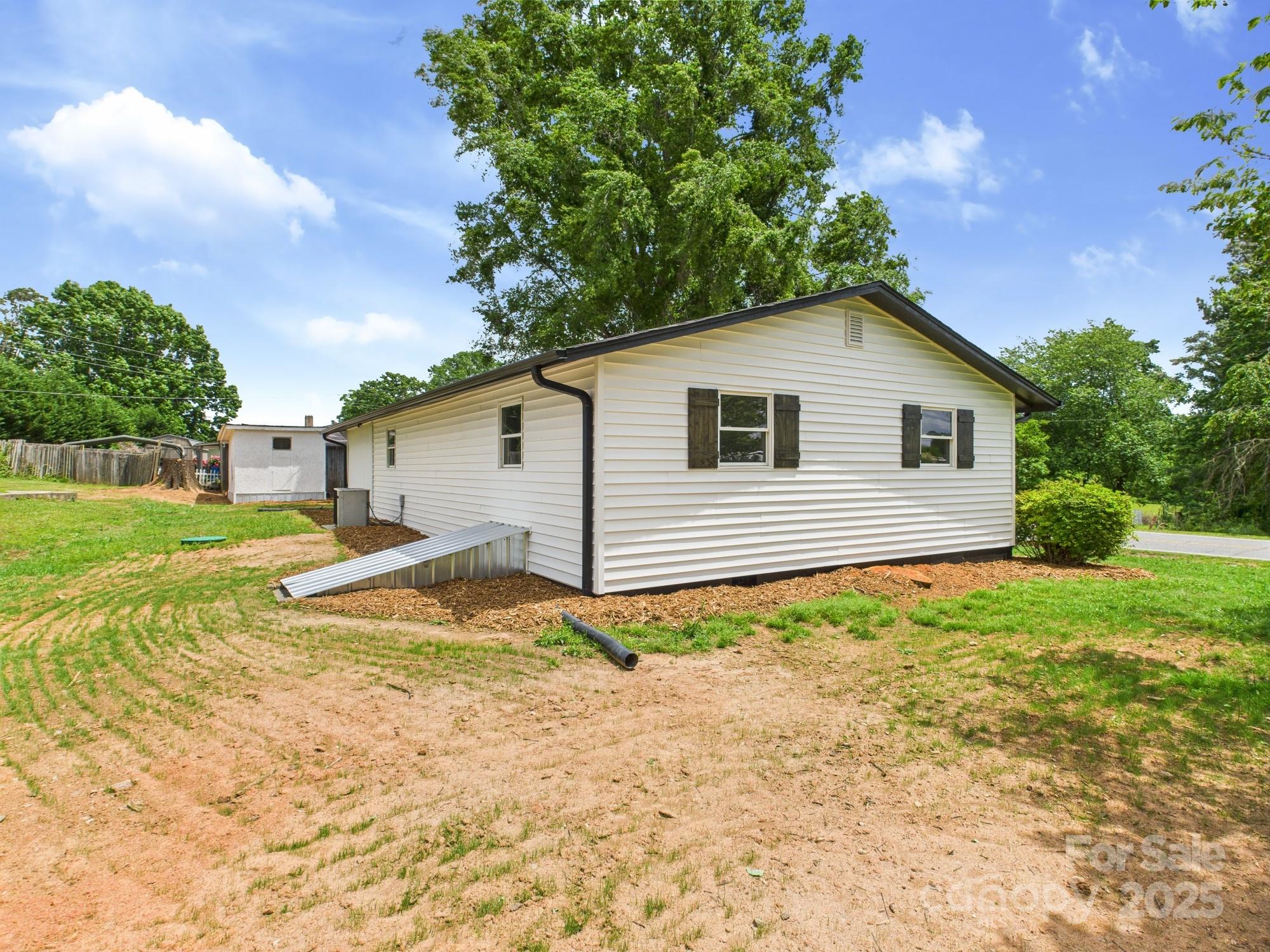 120 Hepler Road Taylorsville, NC 28681 - Photo 5 of 20 a view of a house with backyard and trees