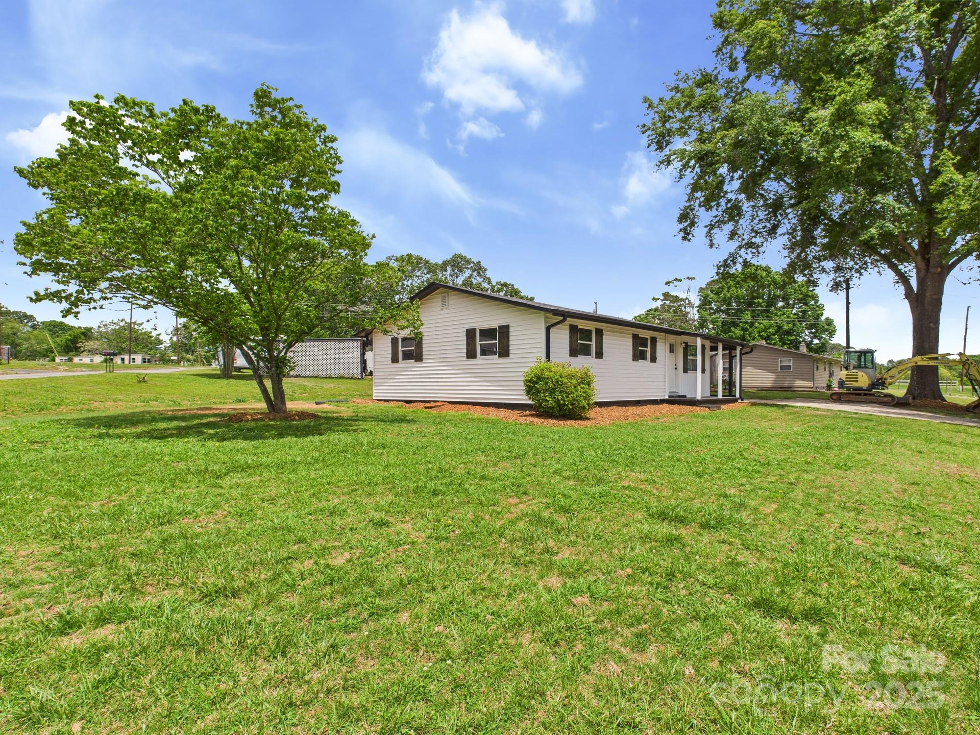 120 Hepler Road Taylorsville, NC 28681 - Photo 6 of 20 a view of a house with a backyard