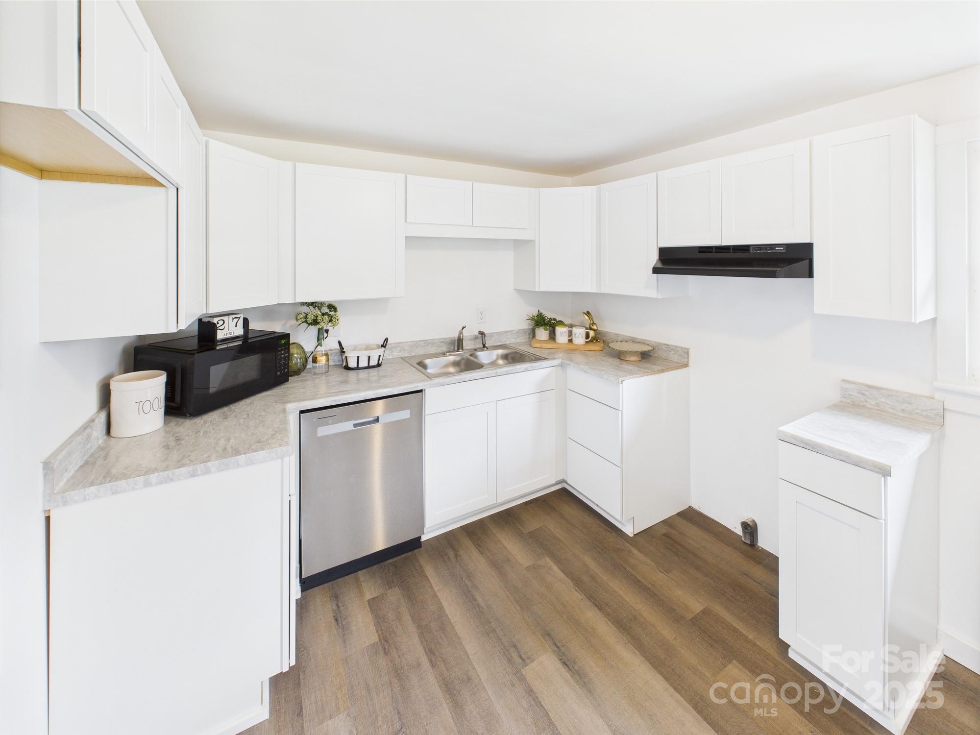 120 Hepler Road Taylorsville, NC 28681 - Photo 7 of 20 a kitchen with a sink a stove and cabinets