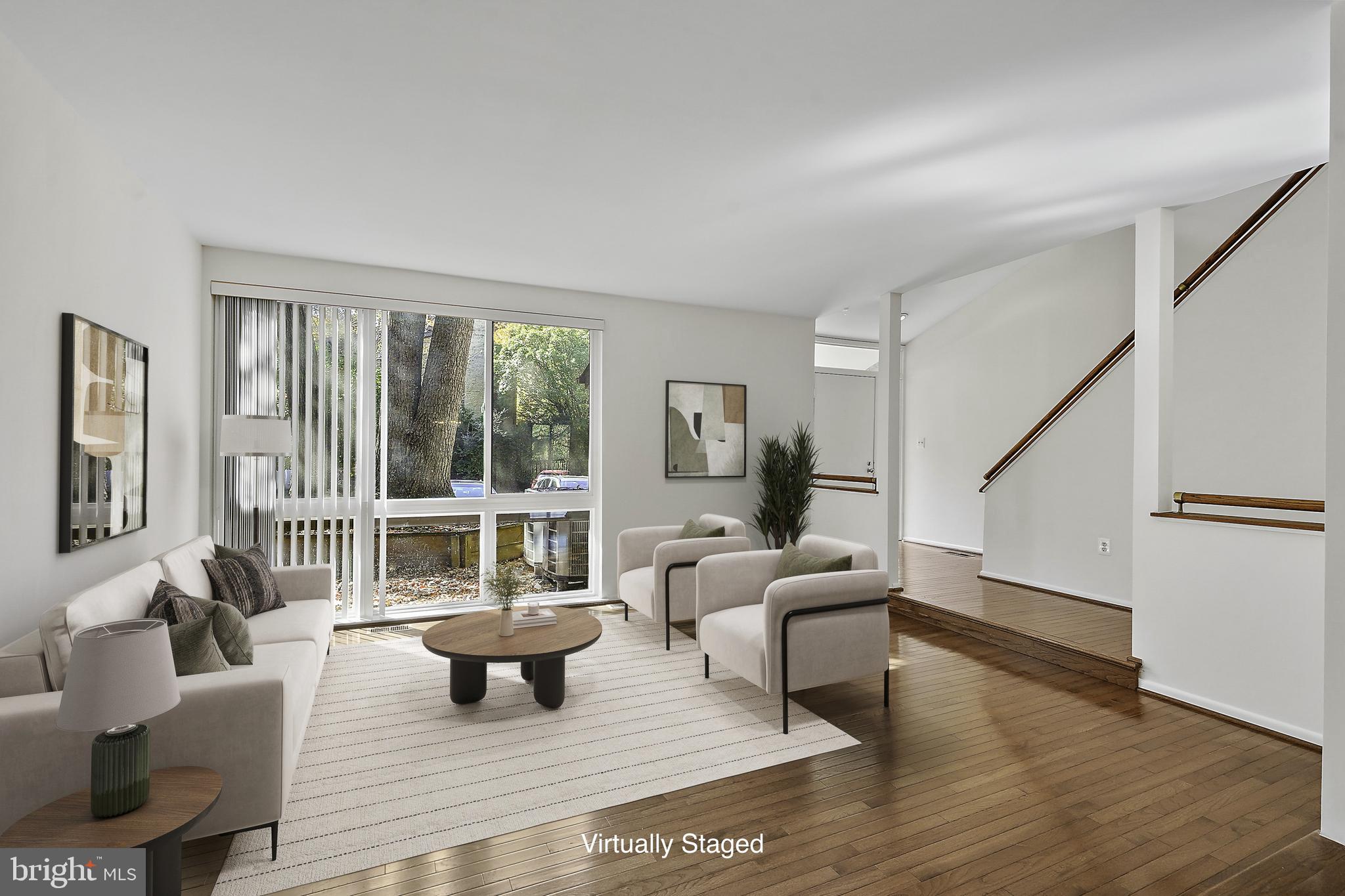 2006 Lakebreeze Way Reston, VA 20191 - Photo 13 of 49 a living room with furniture and a large window